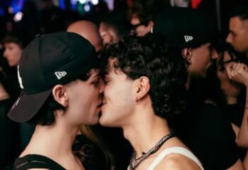 Two men kissing at Muccassassina gay party in Rome. Gay nightlife travel advice. Gay scene in Italy. Gay men travel.