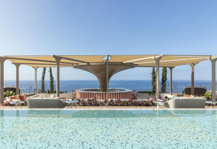 NEXT Hotel Madeira pool view. Gay-friendly hotel, Portugal. Savoy Signature offers luxury travel for gay men. Ocean view, stylish design.