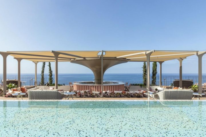 NEXT Hotel Madeira pool view. Gay-friendly hotel, Portugal. Savoy Signature offers luxury travel for gay men. Ocean view, stylish design.
