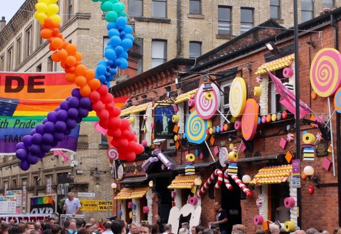 New York New York bar in Manchester's Gay Village at Pride. Rainbow balloons & candy decor. Gay travel advice for the UK.