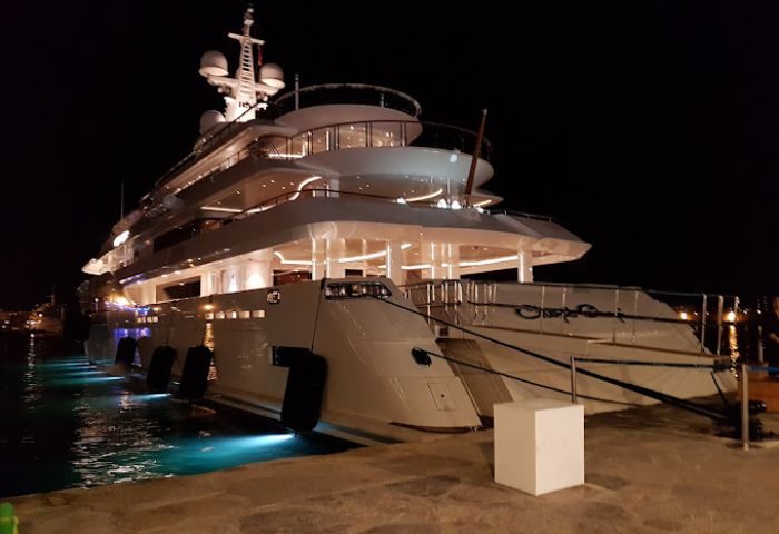 Luxury yacht at night in Ibiza. The Nini Ibiza Bar is a popular gay bar and party spot. Enjoy Ibiza's nightlife in style.