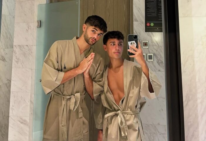 Gay honeymooners at InterContinental Phuket Resort, an IHG Hotel. Two men in robes take a selfie in the bathroom of a beachfront hotel.
