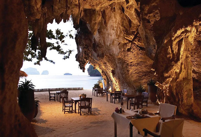 Rayavadee Hotel beachfront dining in a cave, Railay, Krabi. Luxury gay hotel with beach views for gay travelers.