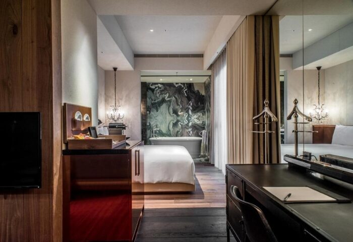 Hotel Proverbs Taipei room. Upscale gay-friendly hotel with marble bathroom, desk, & wood floors. Number one gay hotels Taipei city center.