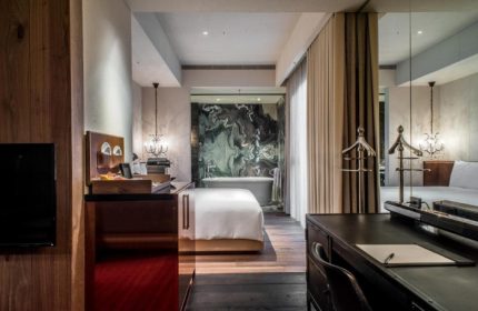 Hotel Proverbs Taipei room. Upscale gay-friendly hotel with marble bathroom, desk, & wood floors. Number one gay hotels Taipei city center.