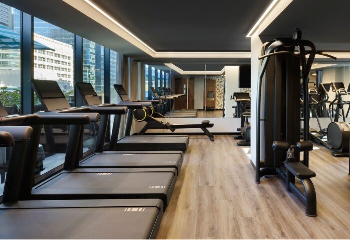Le Meridien Melbourne gym. Wellness for gay men with treadmills, rowing machine, and weight machines. Rooftop pool hotel.