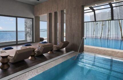 JW Marriott Hotel Istanbul Marmara Sea luxury wellness gay hotel pool and lounge chairs. Relaxing spa day for gay men travelers.