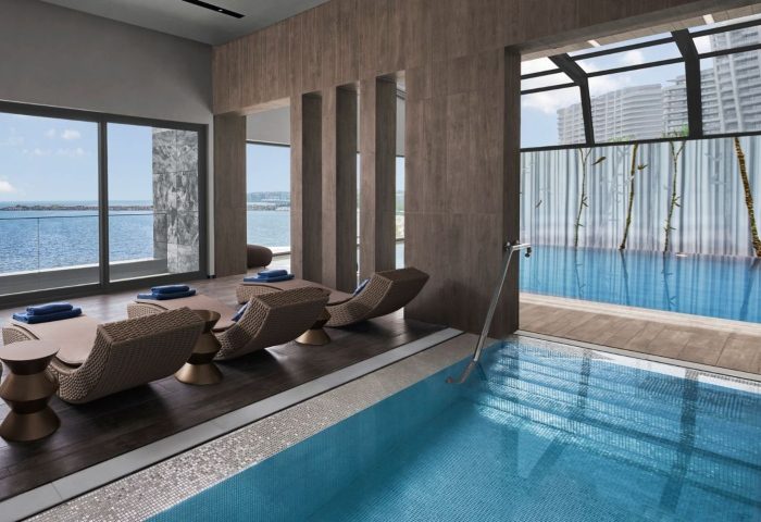 JW Marriott Hotel Istanbul Marmara Sea luxury wellness gay hotel pool and lounge chairs. Relaxing spa day for gay men travelers.
