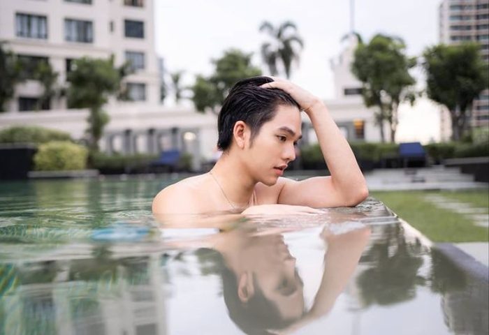 Gay-friendly Sathorn Vista, Bangkok - Marriott Executive Apartments: Man relaxing in the pool at this popular gay hotel in Bangkok.