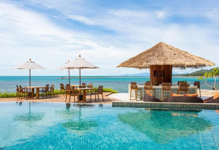 Rocky's Boutique Resort Koh Samui: Private beachfront resort for gay honeymooners. Poolside bar and dining with ocean view.