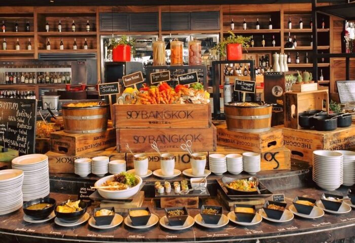 SO/ Bangkok's brunch buffet at Number One Bar, perfect for a gay night out in Silom. A variety of food on display, including seafood and salads.