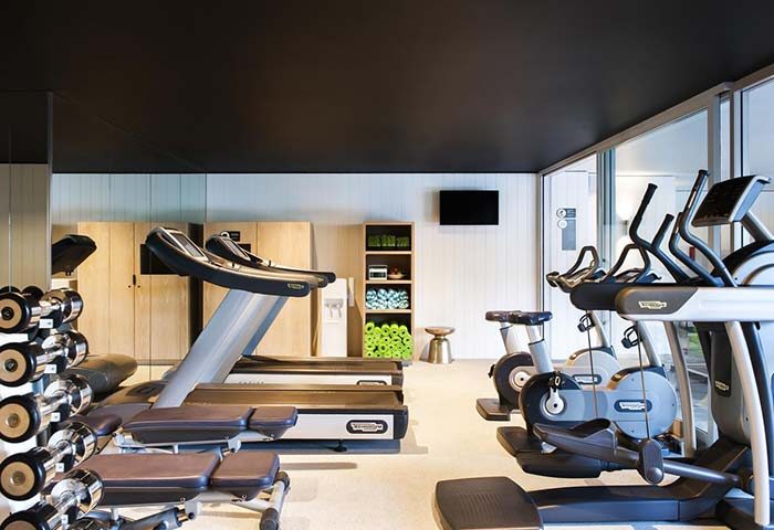 Ovolo Woolloomooloo Hotel gym in Sydney. Treadmills, weights, and exercise bikes. Gay-popular hotel fitness center.