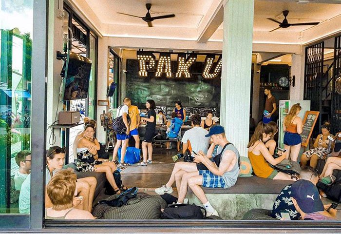 Pak Up Hostel, Krabi. Guests relax in the common area of this gay-friendly hotel. A social hub for gay travelers in Thailand.