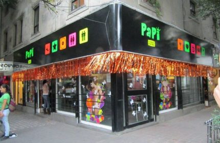 Papi Fun Bar gay party in Mexico. Exterior view of the bar with colorful signage and decorations. Gay travel advice.