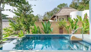 Paradee Resort Koh Samet pool villa. Beachfront resort with lush greenery, tropical plants, and a private pool, perfect for gay travel.