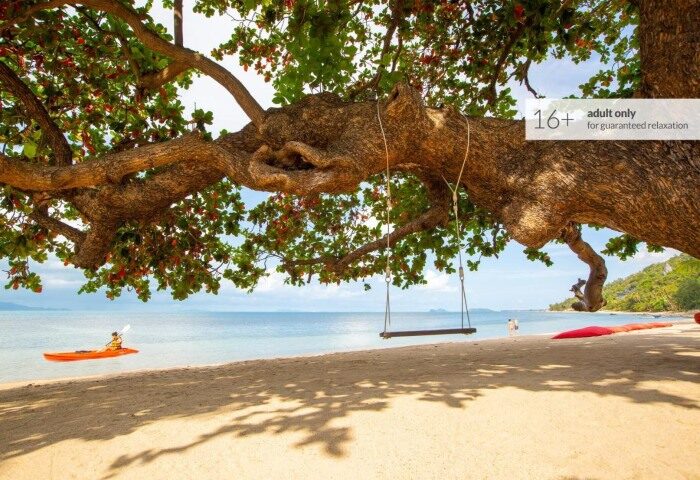 Koh Phangan adults-only beachfront hotel. Kayaker, swing, and beach at Explorar Hotel. Perfect gay resort for relaxation.