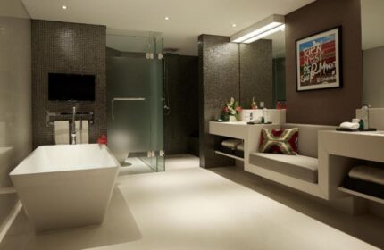 Double-Six Luxury Hotel Seminyak bathroom. Modern design with tub, shower, and vanity. Perfect for a gay beach honeymoon in Bali.