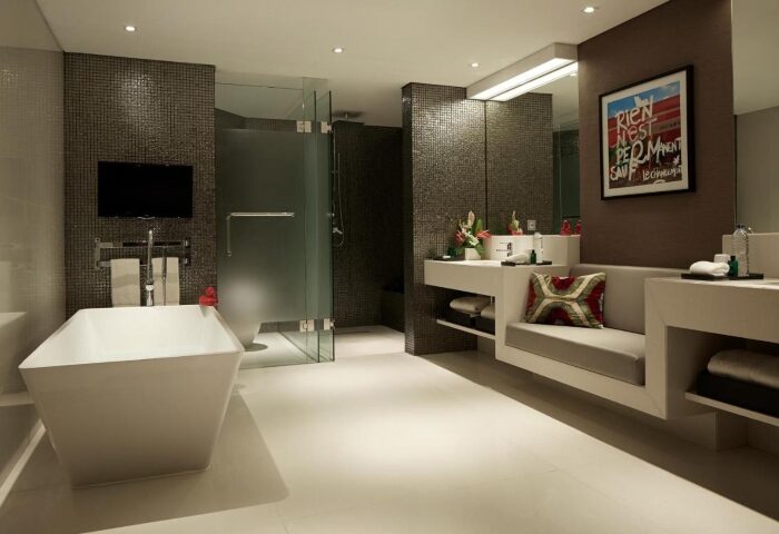 Double-Six Luxury Hotel Seminyak bathroom. Modern design with tub, shower, and vanity. Perfect for a gay beach honeymoon in Bali.