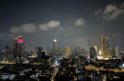 Bangkok Marriott Surawongse Hotel night view. Perfect gay-friendly hotels for gay nightlife. Cityscape with illuminated buildings.