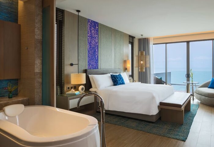 Renaissance Pattaya Resort & Spa suite for a gay honeymoon. Beach view, tub, king bed. Perfect for a gay beach holiday near Bangkok, Thailand.