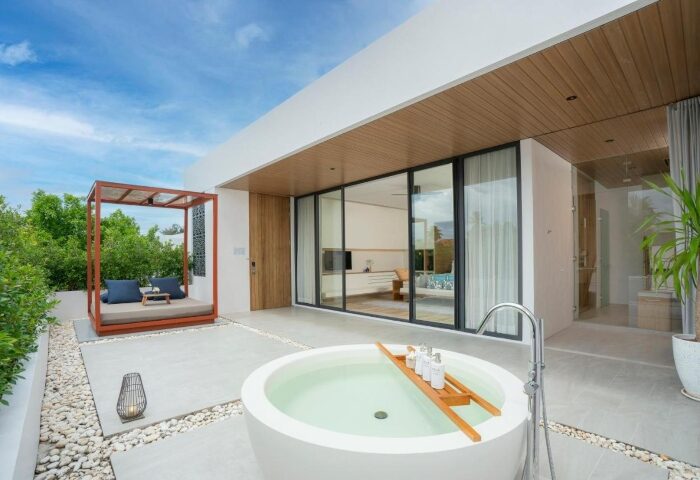 Melia Phuket Mai Khao gay honeymoon beach resort: Villa exterior with daybed and bathtub. Perfect for a gay couple's romantic getaway.