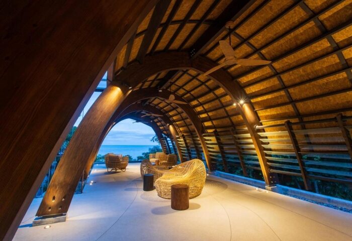 Rocky's Boutique Resort Veranda, Samui. Perfect beachfront pool villas for gay honeymoon. Arched wooden structure with ocean view.