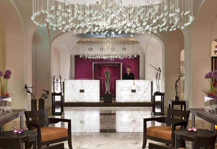 Sofitel Legend The Grand Amsterdam lobby. Honeymoon hotel reception area with chandeliers. Perfect gay honeymoon hotel in Amsterdam.