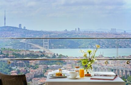 Breakfast with a view at Raffles Istanbul Hotel, perfect for a gay honeymoon. Overlooking the Bosphorus, a luxury gay travel experience.