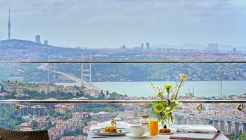 Breakfast with a view at Raffles Istanbul Hotel, perfect for a gay honeymoon. Overlooking the Bosphorus, a luxury gay travel experience.
