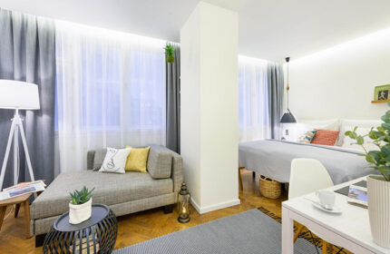 Mosaic House Design Hotel, Prague. A perfect gay honeymoon hotel in Prague's Old Town. Modern room interior with bed and couch.