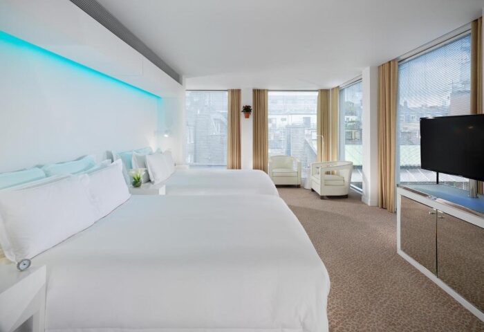 St Martins Lane Hotel London room for four people. Perfect gay hotels Soho. Modern design, two beds, and city views.