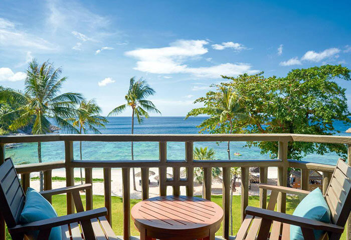 Phuket Marriott Resort Merlin Beach balcony view. Perfect gay honeymoon hotel. Ocean, palms, and relaxation for LGBTQ+ travelers.