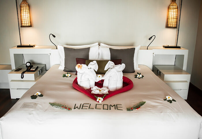 Anantara Rasananda Koh Phangan villa honeymoon suite. Towel elephants on bed, heart shape, welcome message. Gay couples private pool.