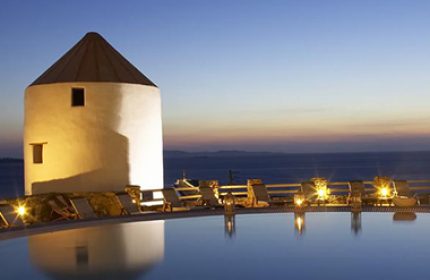 Porto Mykonos Hotel pool view at dusk. Instagram Hotel in Mykonos Town, Gayborhood. Perfect spot for gay men's travel in Mykonos.