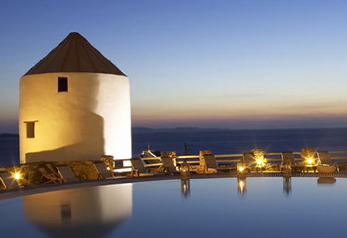 Porto Mykonos Hotel pool view at dusk. Instagram Hotel in Mykonos Town, Gayborhood. Perfect spot for gay men's travel in Mykonos.