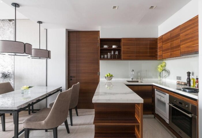 Bangkok Marriott Surawongse honeymoon suite kitchen. Perfect for gay couples' hotel stay. Modern design with wood cabinets and marble countertop.