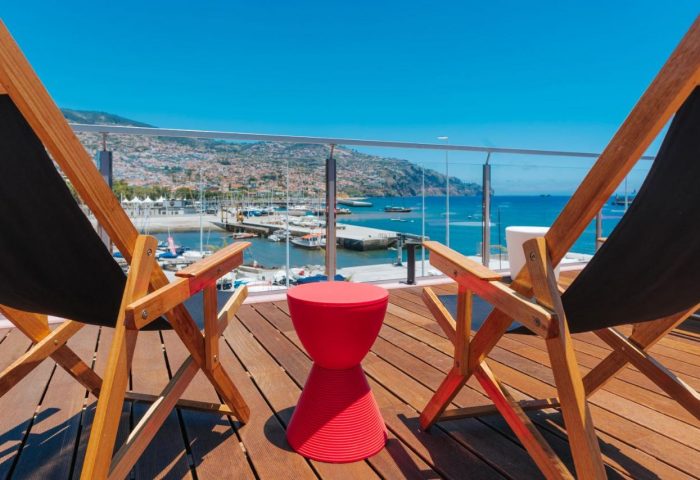 Deck chairs at Pestana CR7 Funchal, a gay-friendly hotel in Madeira. Relax with ocean views. Perfect gay travel destination.