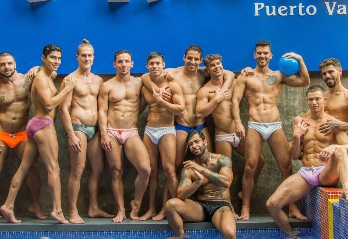 Group of shirtless men in swim briefs at Piñata PV Gay Hotel in Puerto Vallarta. Gay travel and lifestyle.