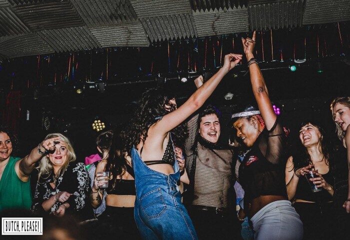 People dancing at Royal Vauxhall Tavern, a popular gay bar in London known for its drag shows and vibrant nightlife.