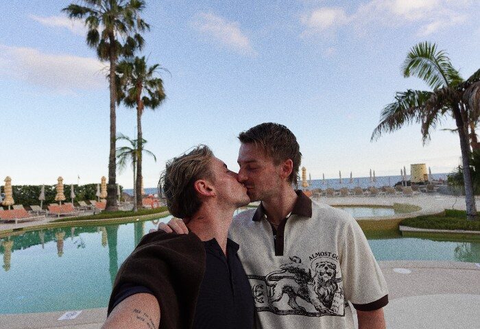 Gay Couple Kissing at Rooftop Pool NEXT Hotel Madeira