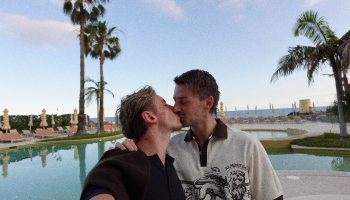 Gay Couple Kissing at Rooftop Pool NEXT Hotel Madeira