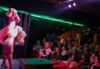 Drag queen performing at Pride of Footscray in Melbourne. Gay travel destination with live entertainment and a supportive community.