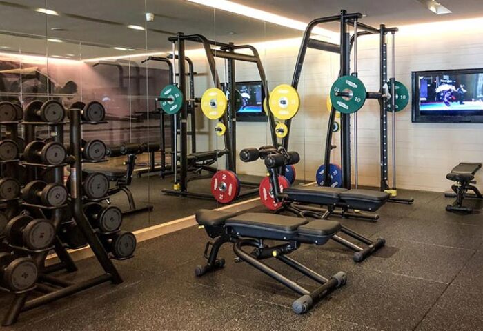 Pullman Bangkok Hotel G Silom gym. Weights, benches, and machines for a workout. Fitness center for gay travelers in Bangkok, Thailand.