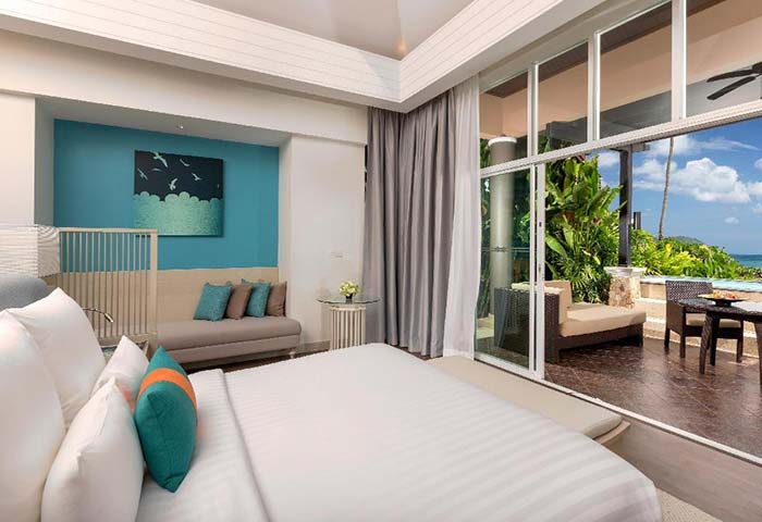Pullman Phuket Panwa Beach Resort room. Gay-friendly hotel with ocean view, balcony, and pool. Luxury travel for gay men in Phuket, Thailand.
