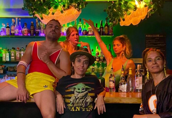 Purex Clube Lisbon: Gay bar scene with diverse group. Quirky decor, colorful drinks. Gay travel in Lisbon, Portugal. Nightlife fun.
