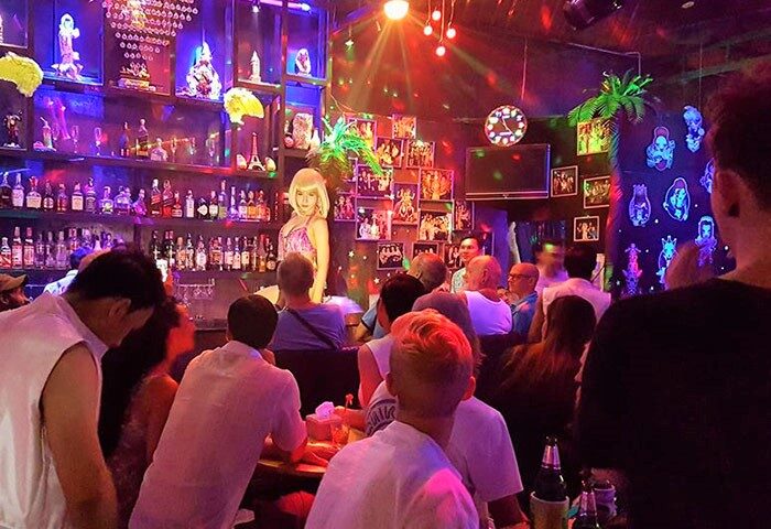 Ram Bar, Chiang Mai. Gay bar interior with drag queen show. Crowd enjoying the nightlife. Gay travel destination in Thailand.