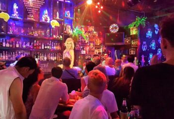 Ram Bar, Chiang Mai. Gay bar interior with drag queen show. Crowd enjoying the nightlife. Gay travel destination in Thailand.