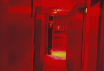 Red-lit corridor inside Reds Cruising Club, a gay cruise club in Gran Canaria. Dark, intimate setting for gay men's travel.