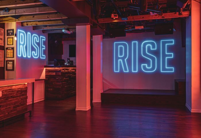 Interior of Rise Gay Bar in New York with neon signs. A popular destination for gay men, this bar offers a vibrant nightlife scene.