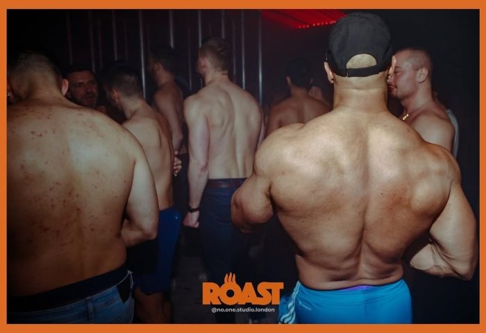 ROAST London gay club scene. Muscular men at a gay event. Gay London nightlife, shirtless men, party atmosphere. Gay clubs in London.